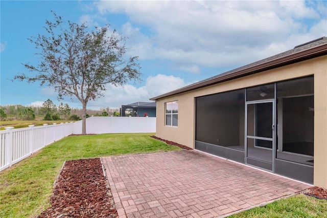view of yard with a patio area and a sunroom