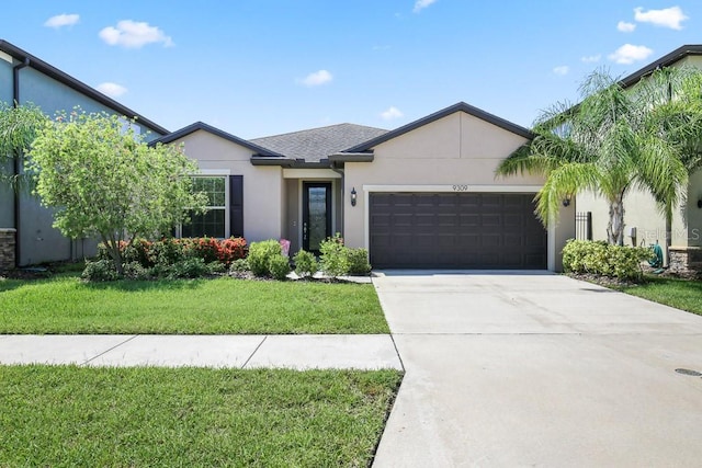 9309 Tradewater Oaks Ct, Riverview, FL 33578 - view of front of property featuring stucco siding, a garage, a front lawn, and concrete driveway