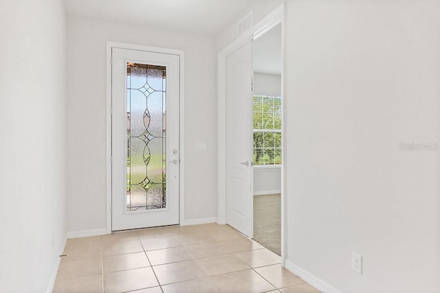 9309 Tradewater Oaks Ct, Riverview, FL 33578 - foyer featuring healthy amount of natural light, baseboards, and light tile patterned floors