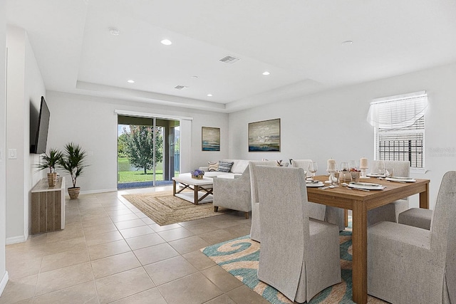 9309 Tradewater Oaks Ct, Riverview, FL 33578 - dining space featuring a tray ceiling, baseboards, light tile patterned floors, and recessed lighting