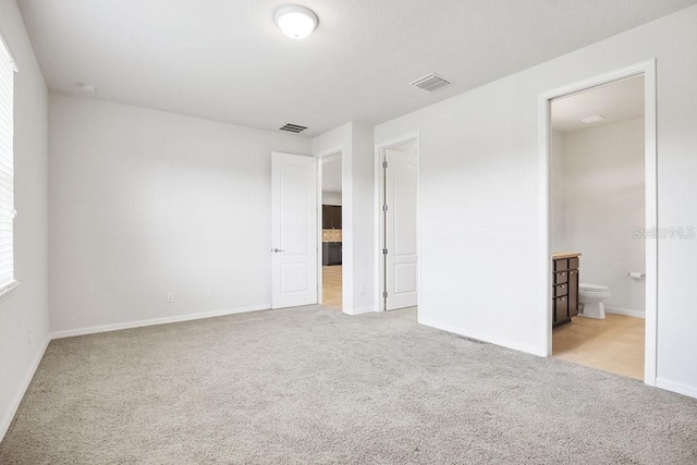 9309 Tradewater Oaks Ct, Riverview, FL 33578 - unfurnished bedroom featuring carpet flooring, baseboards, and connected bathroom