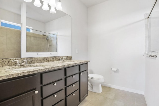 9309 Tradewater Oaks Ct, Riverview, FL 33578 - bathroom with toilet, tiled shower, double vanity, a chandelier, and tile patterned floors