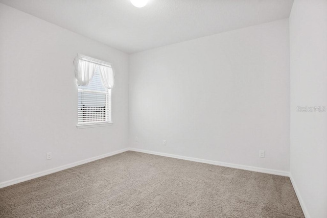 9309 Tradewater Oaks Ct, Riverview, FL 33578 - carpeted empty room featuring baseboards