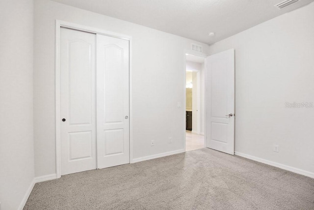 9309 Tradewater Oaks Ct, Riverview, FL 33578 - unfurnished bedroom featuring carpet, a closet, and baseboards