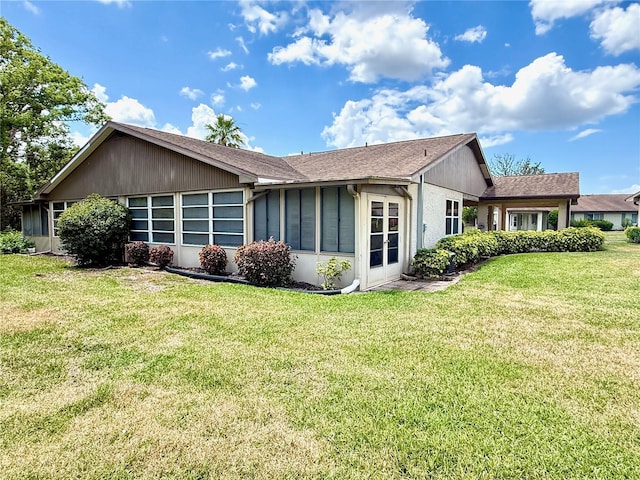 view of side of home featuring a yard