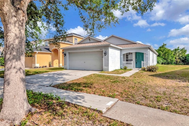 8561 Deer Chase Dr, Riverview, FL 33578 - view of front facade featuring an attached garage, concrete driveway, stucco siding, a front yard, and a shingled roof