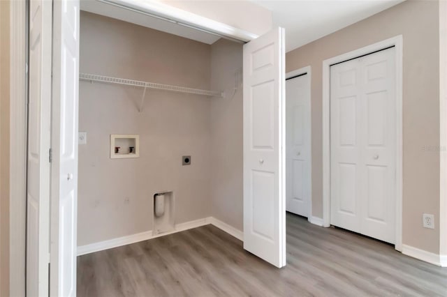 8561 Deer Chase Dr, Riverview, FL 33578 - laundry room featuring laundry area, electric dryer hookup, hookup for a washing machine, and light wood-type flooring