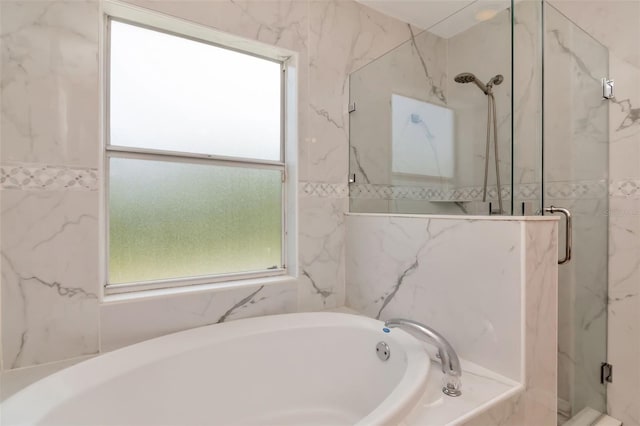 8561 Deer Chase Dr, Riverview, FL 33578 - bathroom featuring a garden tub, a marble finish shower, and plenty of natural light