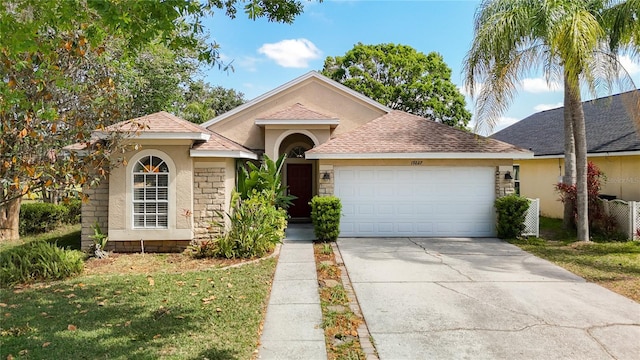 19227 Garden Quilt Cir, Lutz, FL 33558 - ranch-style home with a garage, stone siding, roof with shingles, stucco siding, and concrete driveway