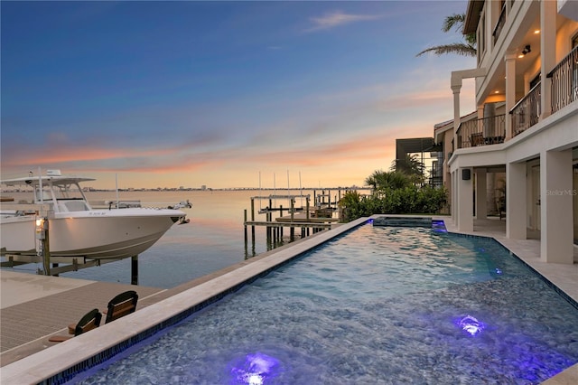 5939 Bayview Cir S, Gulfport, FL 33707 - view of dock with boat lift, a water view, and an outdoor pool