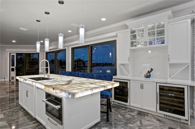 5939 Bayview Cir S, Gulfport, FL 33707 - bar with ornamental molding, a sink, wine cooler, and marble finish floor