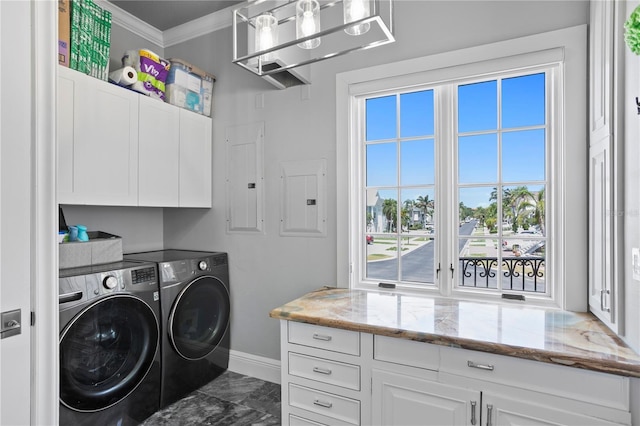 5939 Bayview Cir S, Gulfport, FL 33707 - washroom featuring plenty of natural light, marble finish floor, cabinet space, and independent washer and dryer