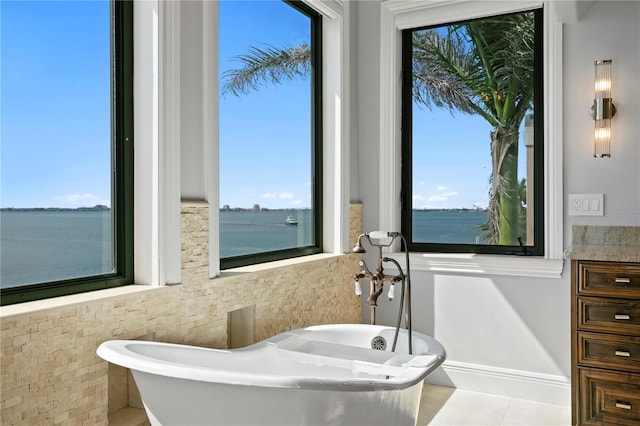 5939 Bayview Cir S, Gulfport, FL 33707 - full bath with tile patterned flooring and a soaking tub