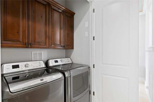 5939 Bayview Cir S, Gulfport, FL 33707 - laundry room with separate washer and dryer and cabinet space