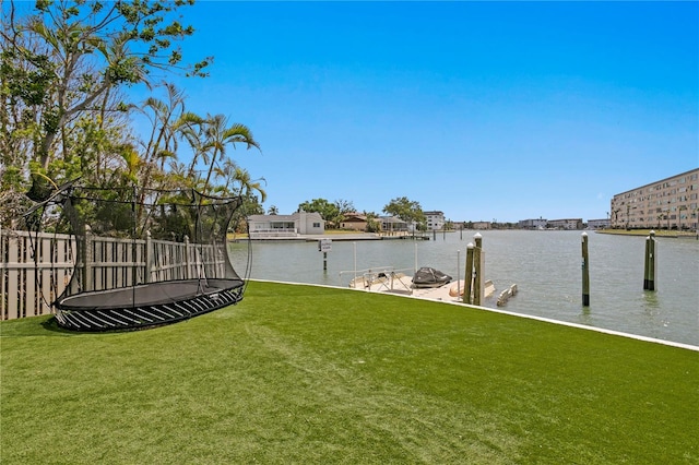 5939 Bayview Cir S, Gulfport, FL 33707 - view of yard with a water view, fence, a trampoline, and a boat dock