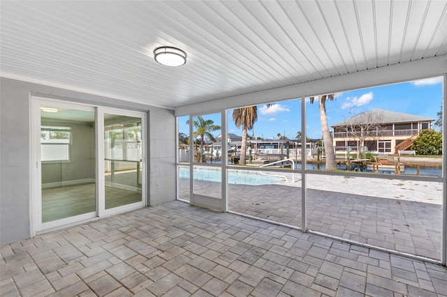 13704 Evelane Dr, Hudson, FL 34667 - unfurnished sunroom with a water view