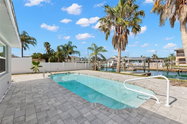 13704 Evelane Dr, Hudson, FL 34667 - view of swimming pool featuring a patio area, boat lift, a water view, fence, and a boat dock