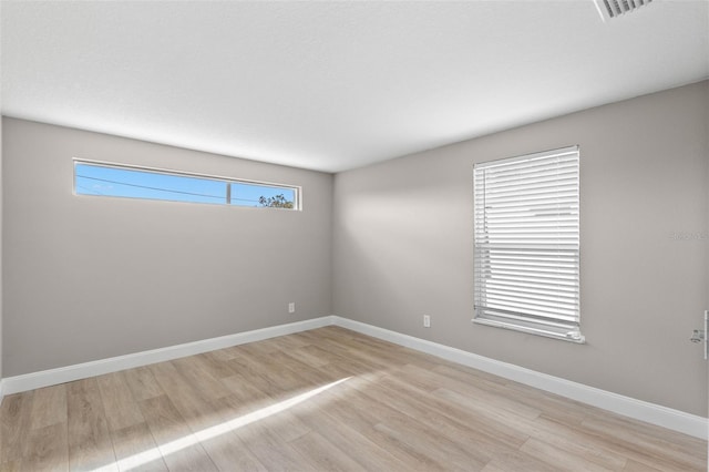 13704 Evelane Dr, Hudson, FL 34667 - empty room with light wood finished floors and baseboards