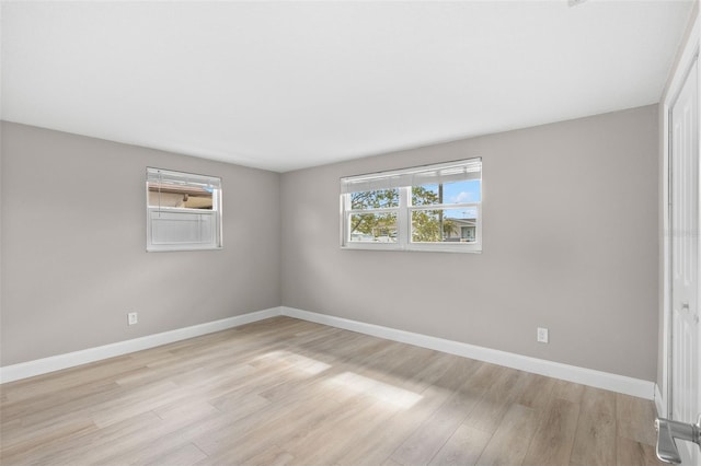 13704 Evelane Dr, Hudson, FL 34667 - unfurnished room with light wood-style floors and baseboards