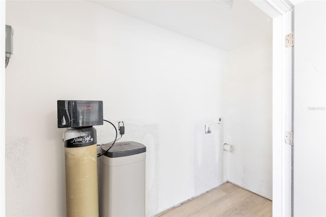 13704 Evelane Dr, Hudson, FL 34667 - laundry room featuring light wood-style floors