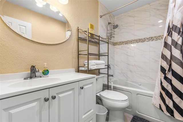 full bathroom with vanity, shower / tub combo with curtain, a textured wall, and toilet