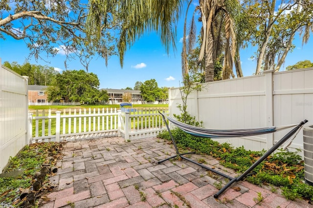 view of patio / terrace featuring fence