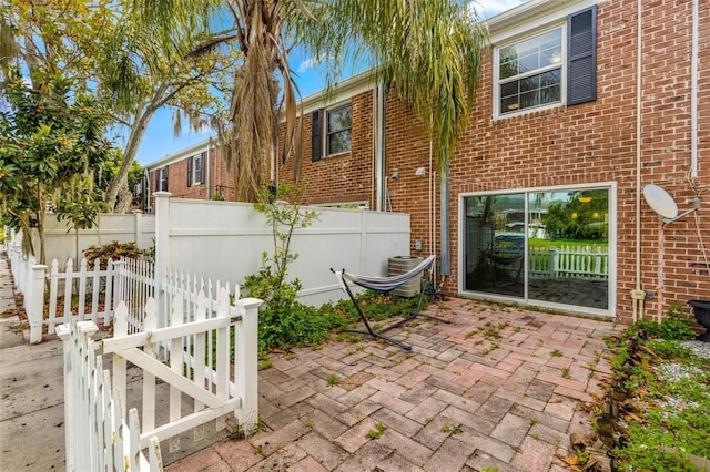 view of patio featuring fence