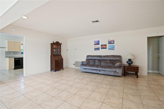 living area with light tile patterned floors, baseboards, recessed lighting, and visible vents