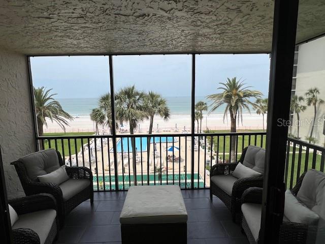 18304 Gulf Blvd Unit 309, Redington Shores, FL 33708 - sunroom / solarium featuring view of water and beach