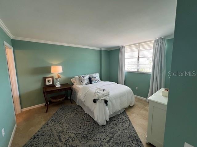 18304 Gulf Blvd Unit 309, Redington Shores, FL 33708 - bedroom with baseboards and ornamental molding