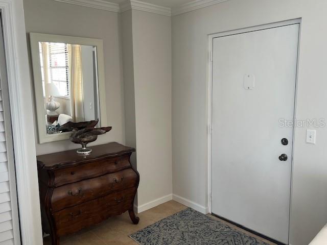 18304 Gulf Blvd Unit 309, Redington Shores, FL 33708 - entryway with crown molding and baseboards