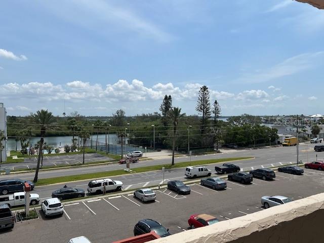 18304 Gulf Blvd Unit 309, Redington Shores, FL 33708 - uncovered parking lot featuring a water view