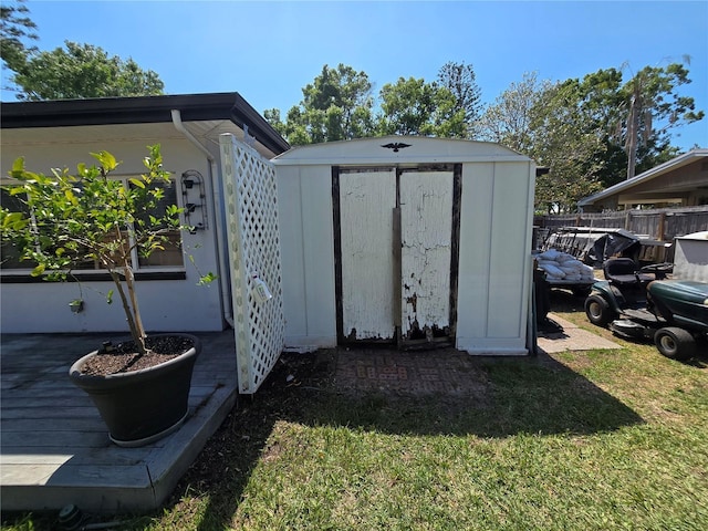 view of shed with fence