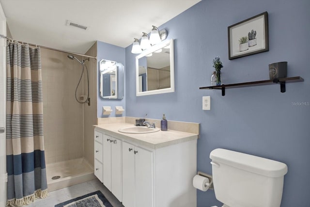 full bathroom with visible vents, tile patterned flooring, vanity, toilet, and a tile shower