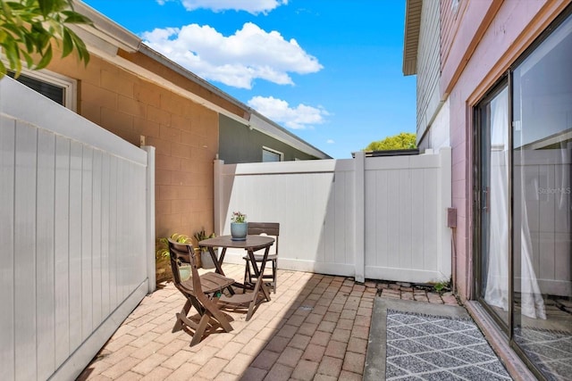 view of patio / terrace featuring fence