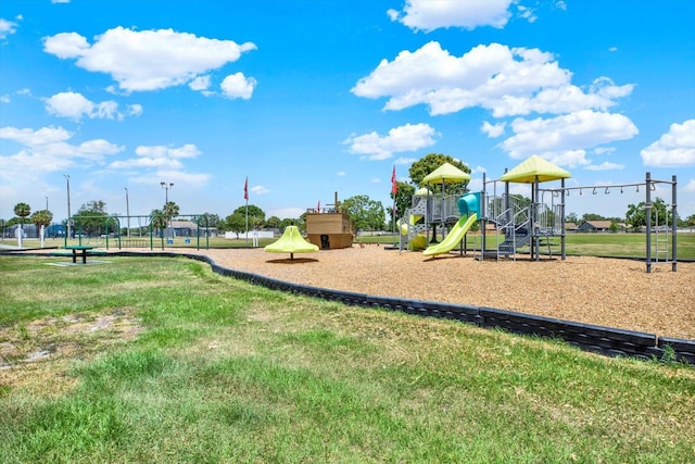 community playground featuring a lawn