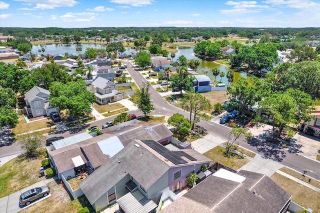 bird's eye view with a residential view and a water view