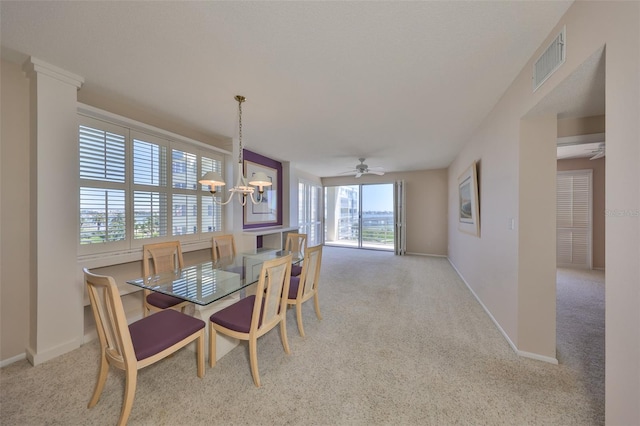 7882 Sailboat Key Blvd S Unit 401, South Pasadena, FL 33707 - dining room featuring carpet flooring, baseboards, and visible vents