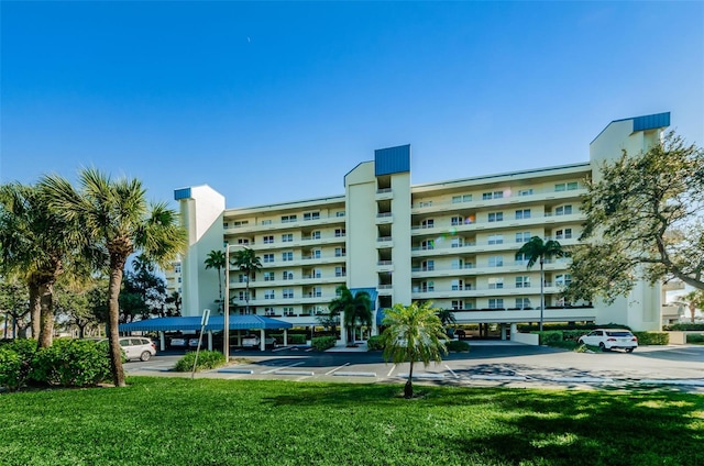 7882 Sailboat Key Blvd S Unit 401, South Pasadena, FL 33707 - view of building exterior featuring uncovered parking