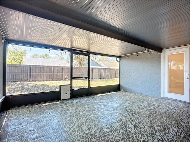 1005 Cameo Crest Ln, Valrico, FL 33596 - unfurnished sunroom featuring plenty of natural light and beamed ceiling