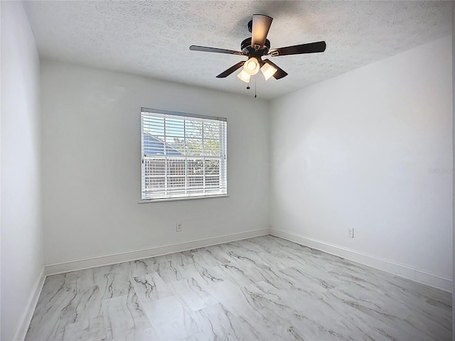 1005 Cameo Crest Ln, Valrico, FL 33596 - unfurnished room with marble look tile flooring, a textured ceiling, baseboards, and ceiling fan