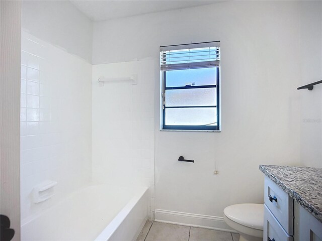 1005 Cameo Crest Ln, Valrico, FL 33596 - full bathroom featuring tile patterned flooring, toilet, vanity, shower / bathtub combination, and baseboards