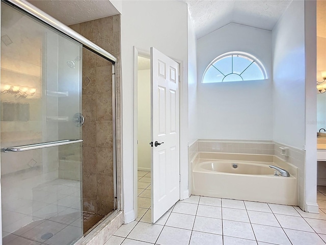 1005 Cameo Crest Ln, Valrico, FL 33596 - full bathroom with a textured ceiling, tile patterned floors, lofted ceiling, a stall shower, and a bath