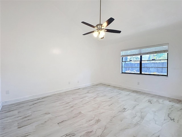 1005 Cameo Crest Ln, Valrico, FL 33596 - unfurnished room featuring a ceiling fan, baseboards, lofted ceiling, and light marble finish flooring