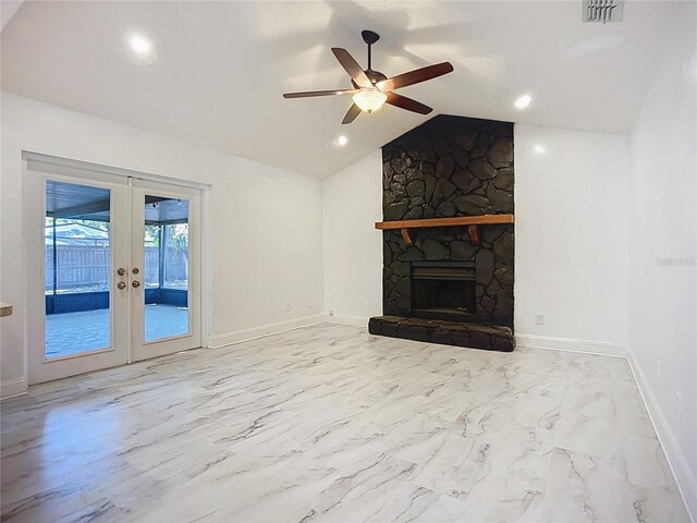 1005 Cameo Crest Ln, Valrico, FL 33596 - unfurnished living room with french doors, ceiling fan, lofted ceiling, baseboards, and a fireplace
