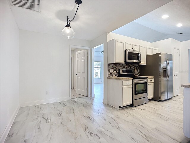 1005 Cameo Crest Ln, Valrico, FL 33596 - kitchen with stainless steel appliances, light marble finish flooring, baseboards, tasteful backsplash, and decorative light fixtures