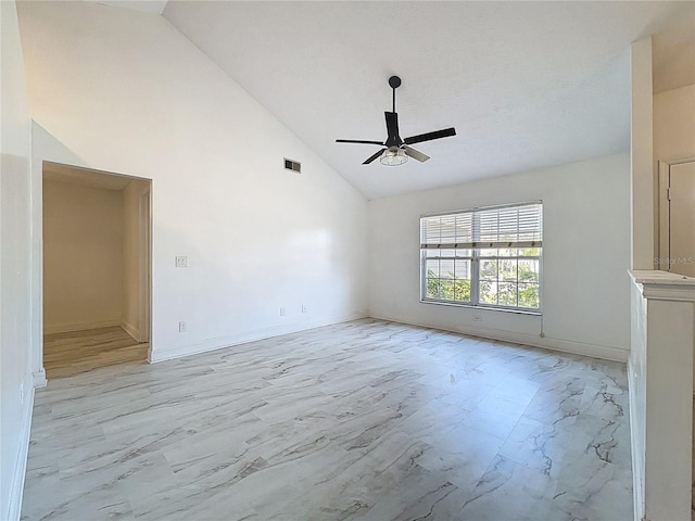 1005 Cameo Crest Ln, Valrico, FL 33596 - unfurnished room featuring light marble finish flooring, ceiling fan, high vaulted ceiling, and baseboards