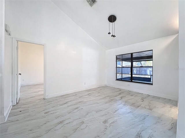 1005 Cameo Crest Ln, Valrico, FL 33596 - unfurnished room with high vaulted ceiling, light marble finish floors, and baseboards