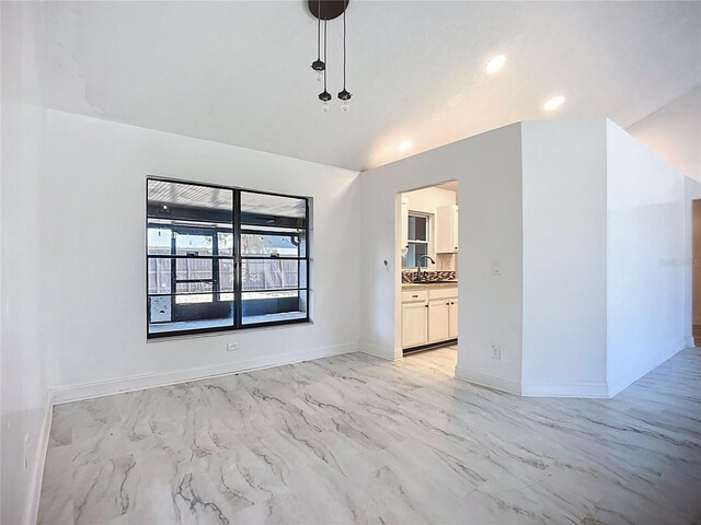 1005 Cameo Crest Ln, Valrico, FL 33596 - unfurnished living room with light marble finish flooring, a sink, baseboards, and recessed lighting