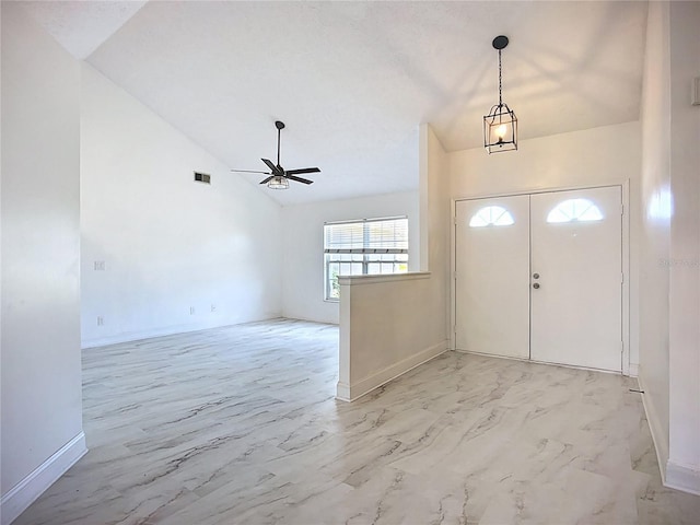 1005 Cameo Crest Ln, Valrico, FL 33596 - foyer entrance featuring ceiling fan, light marble finish floors, vaulted ceiling, and baseboards
